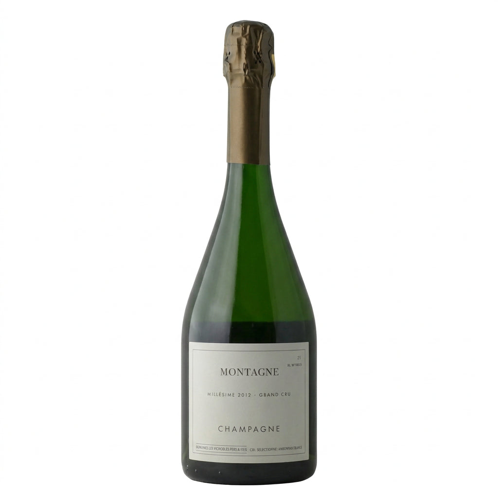 Bottle of Domaine Les Monts Fournois Montagne Grand Cru white wine with label visible and elegant glassware.