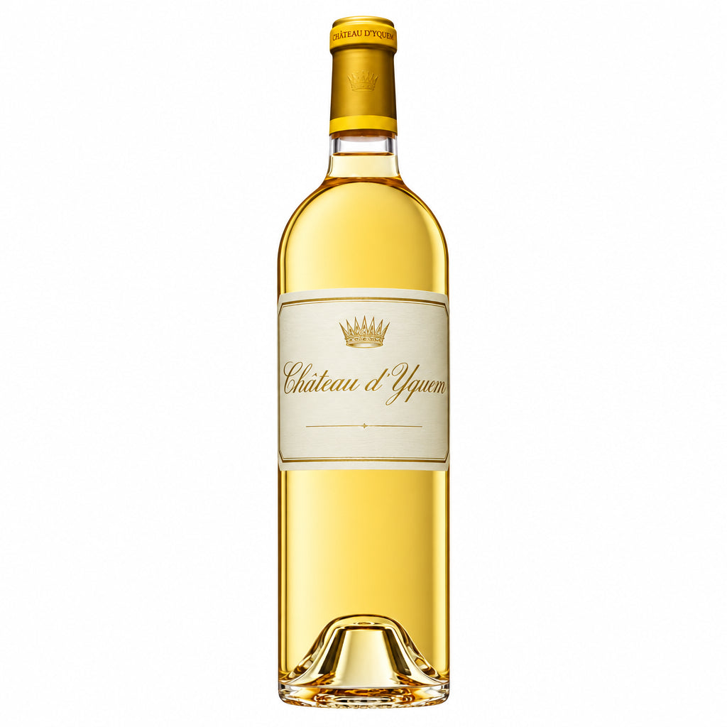 Chateau D'yquem bottle of French sweet wine on a wooden table with a blurred background.