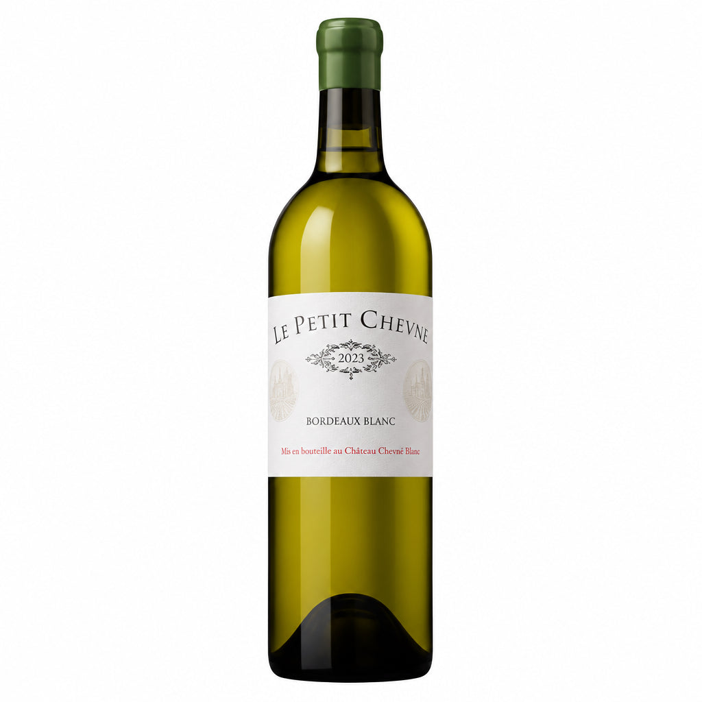 Bottle of Le Petit Cheval Blanc 2023 Bordeaux red wine with label visible and elegant glass.