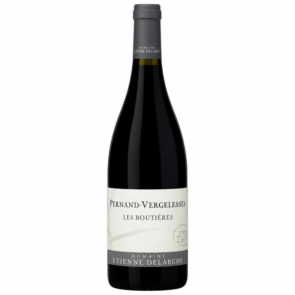 Bottle of Domaine Delarche Pernand-Vergelesses Les Boutieres 2023 white wine with a wine label on a wooden table.